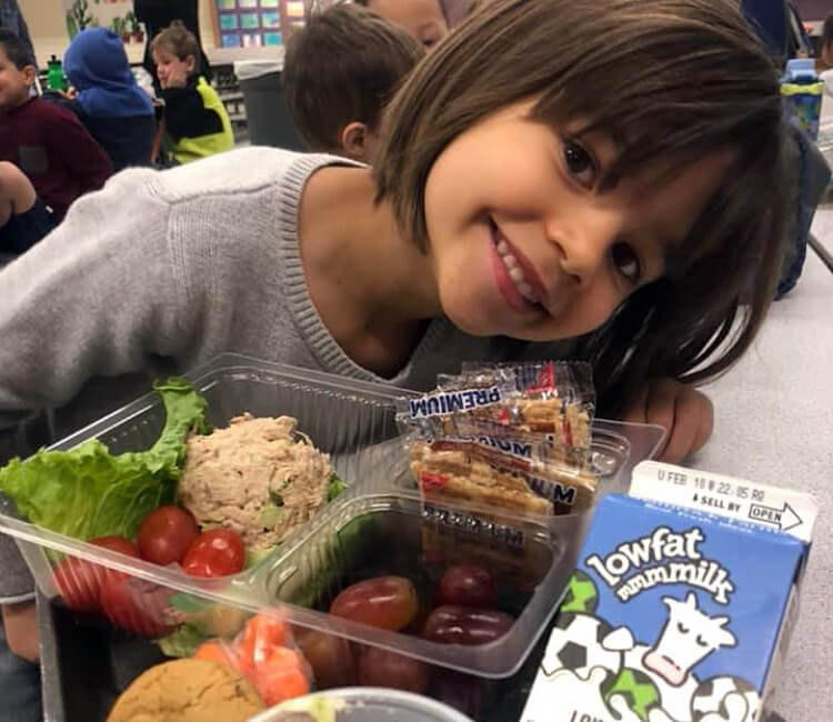 child with healthy school lunch