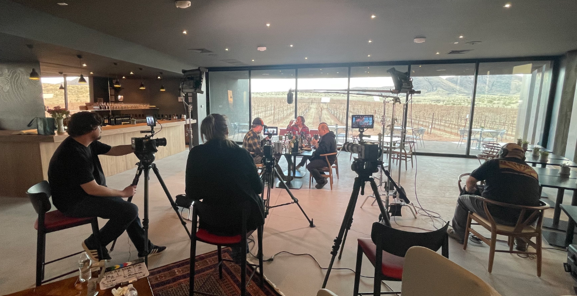 The film crew is inside the tasting room at Los Milics Vineyards in Elgin, Arizona.