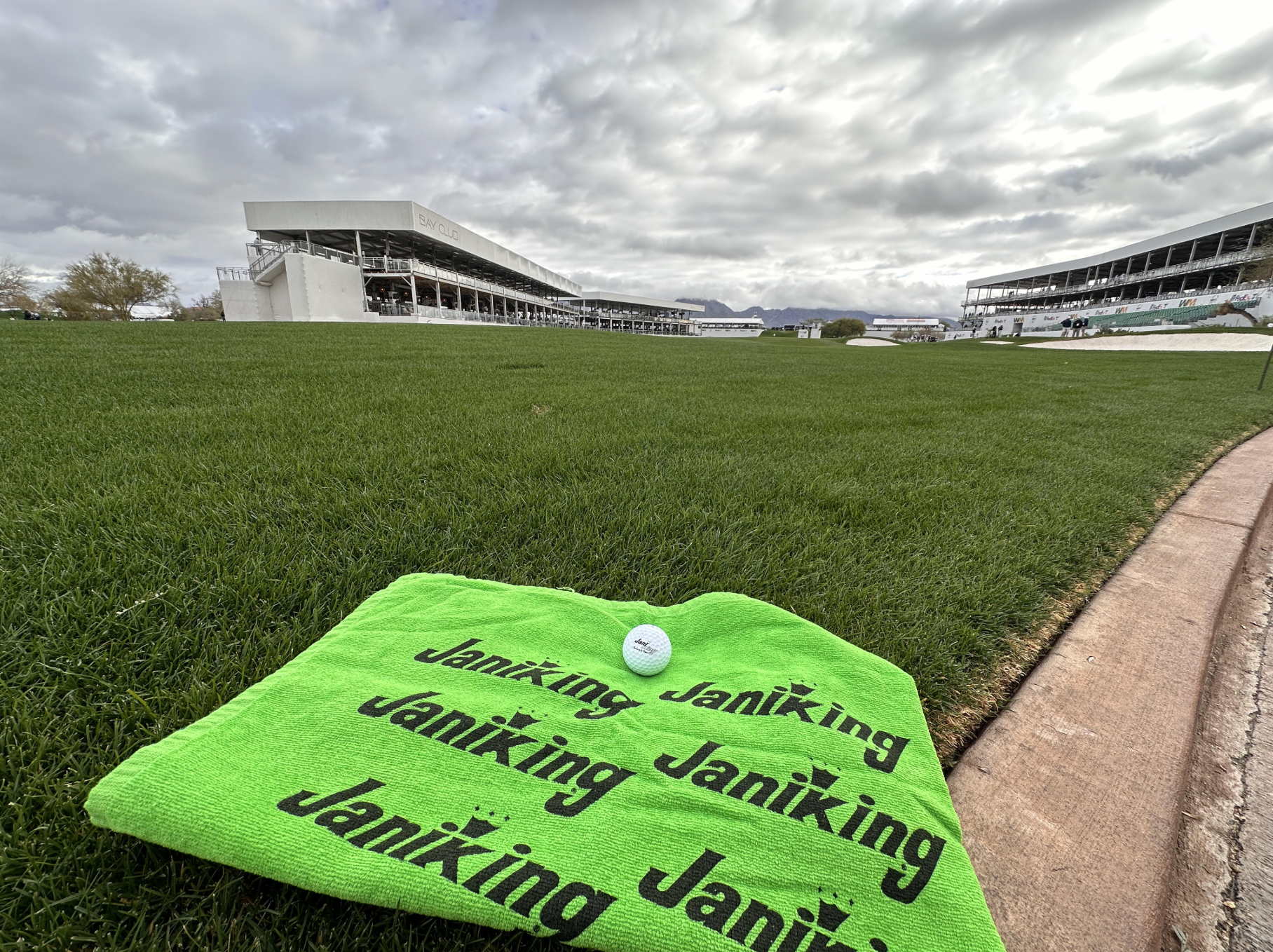 Jani-King towel and golf ball appear before the 16th hole at the 2024 WM Phoenix Open.